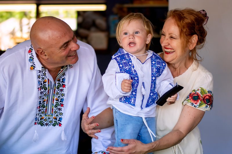 Cibi family in Ukrainian vyshyvanka shirts at their son's first birthday — family story, Australia
